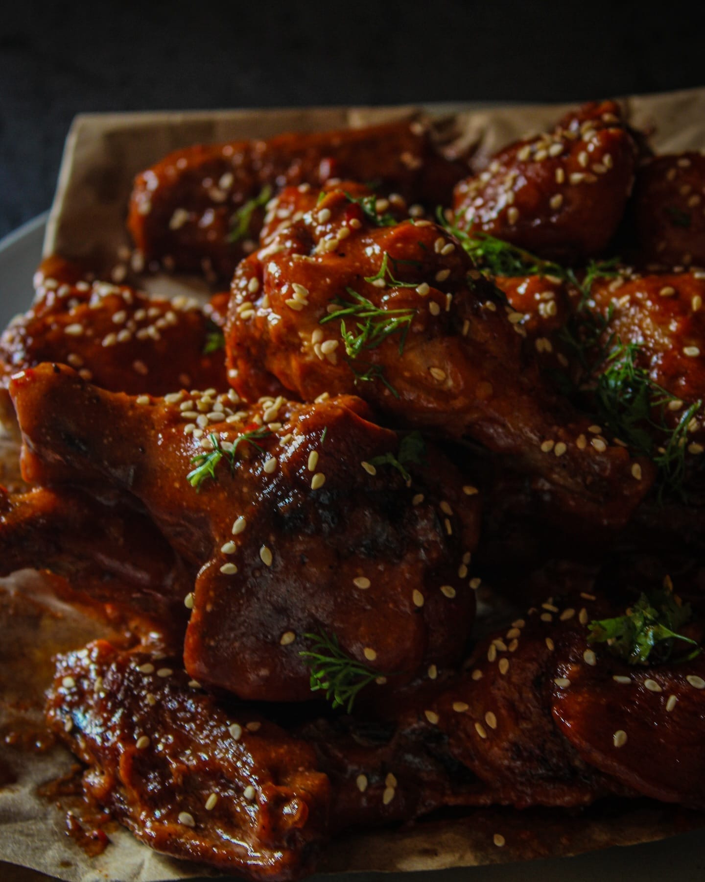 Sticky glazed chicken wings styled by Black Garlic