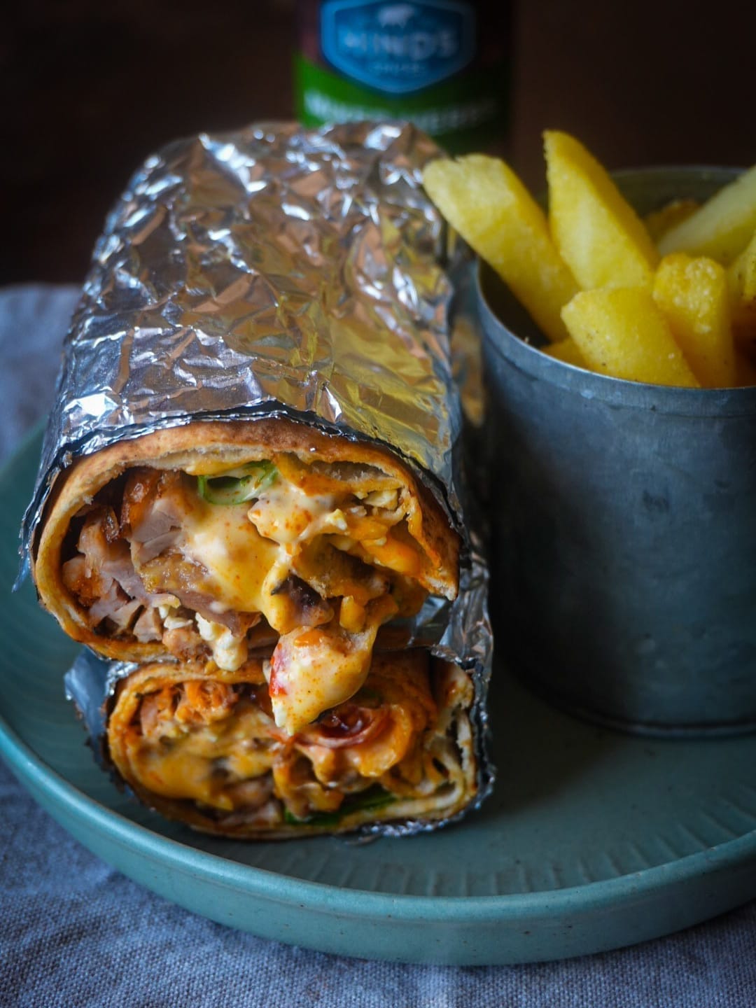 Hinds sauce styled alongside a loaded chicken wrap and fries